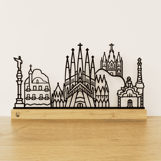 Minimalistisch Barcelona silhouet van zwart staal op een naturel eikenhouten voetstuk.