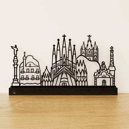 Minimalistisch Barcelona silhouet van zwart staal op een matzwart eikenhouten voetstuk.