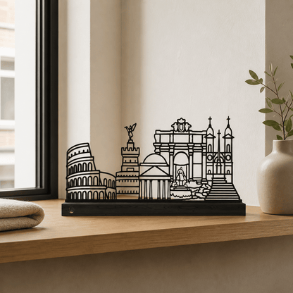 Het stalen silhouet van de monumenten van Rome op een zwart eikenhouten voetstuk.
